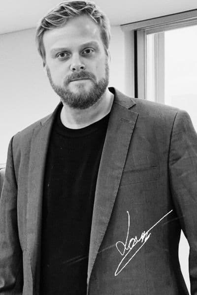 Lars O. Horpestad, founder of Veristria — black-and-white portrait with signature